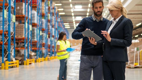 people discussing in warehouse