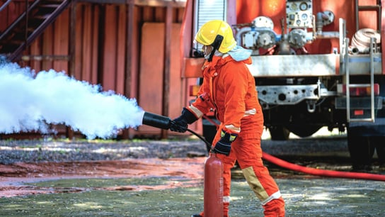 Firefighter wearing full equipment and emergency rescue equipment.