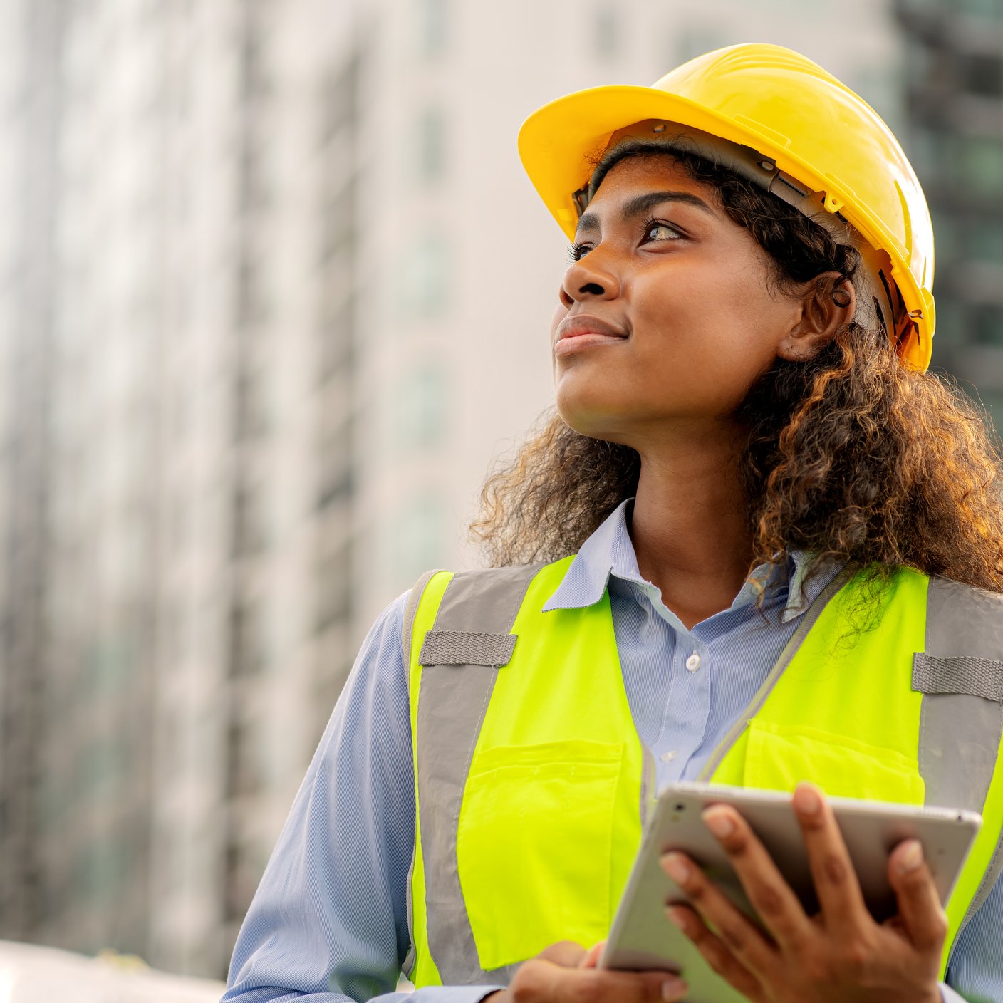 Female engineer holding a laptop