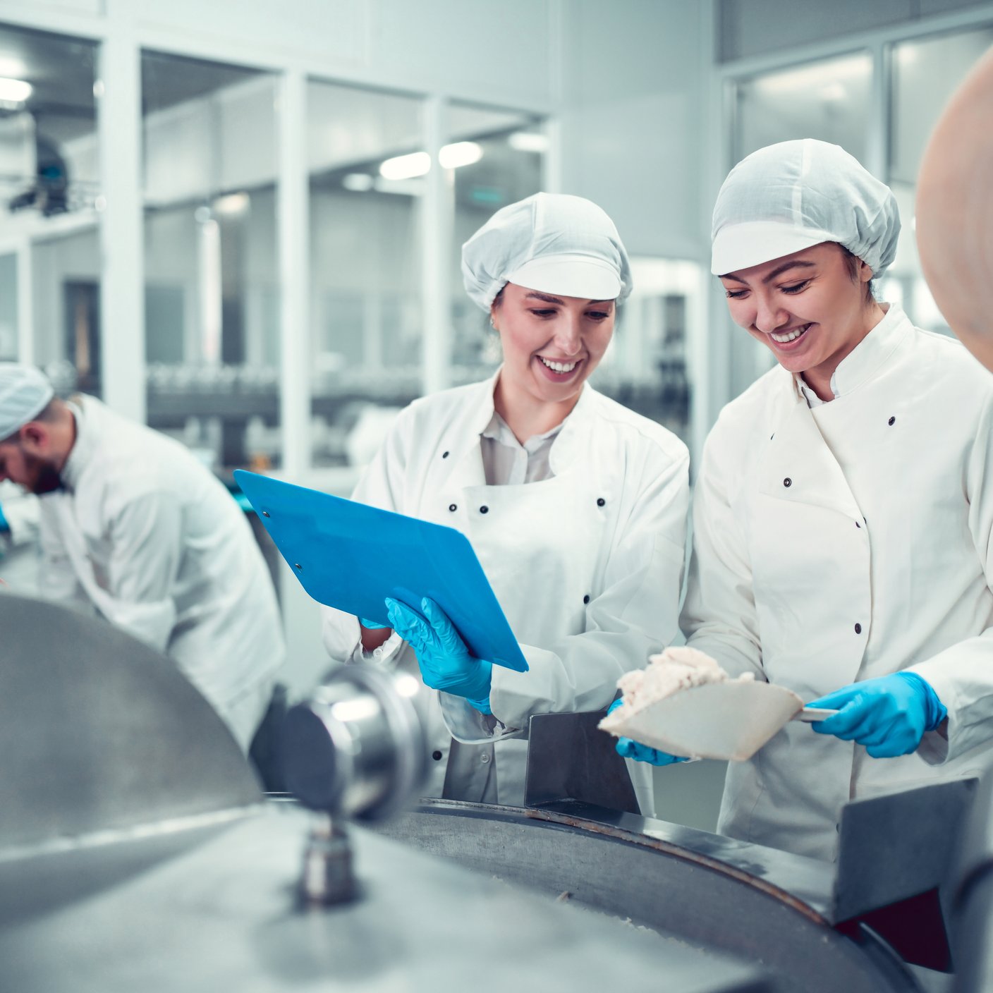 Factory Workers Filling Machine With Cottage Cheese For Stuffed Peppers In Jars.
