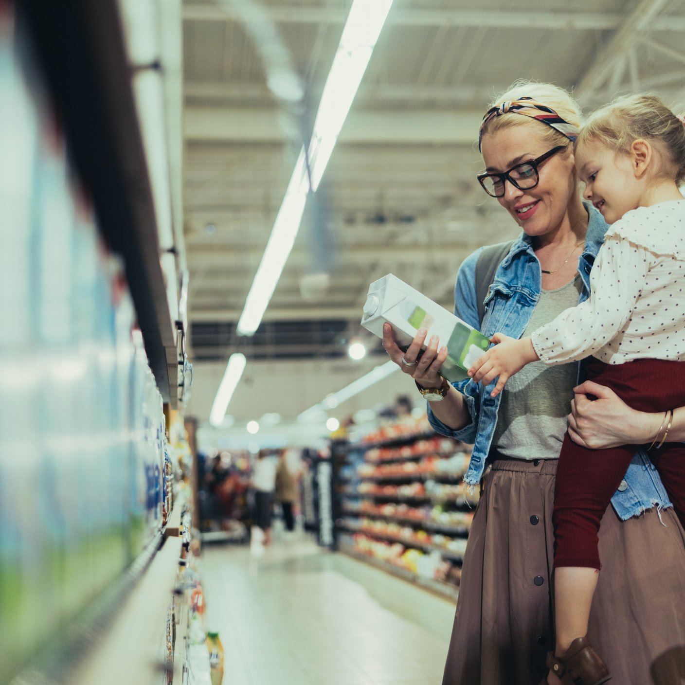 Women shopping with her young daughter in the supermarket