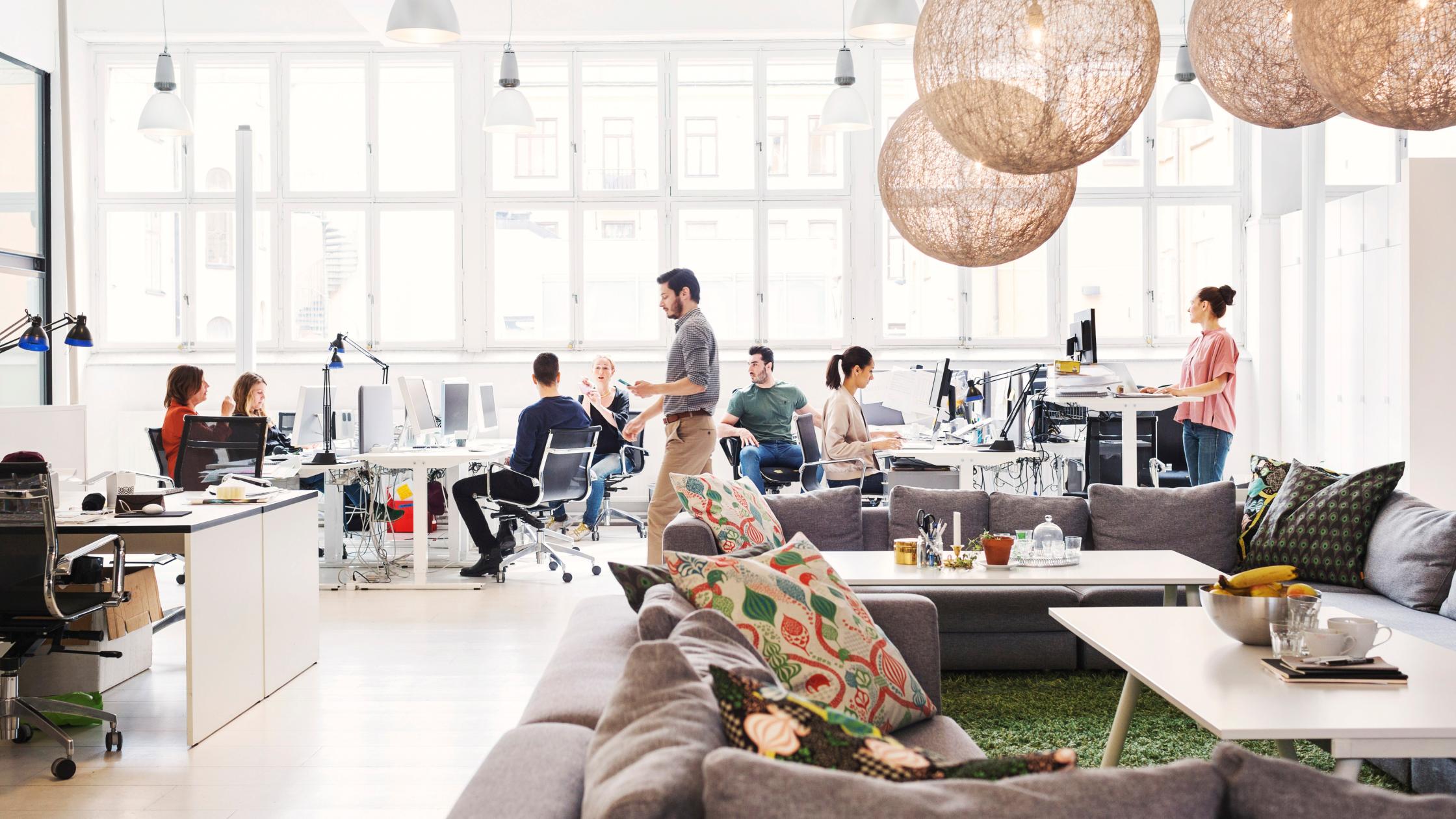 Modern office lobby with business people working in background