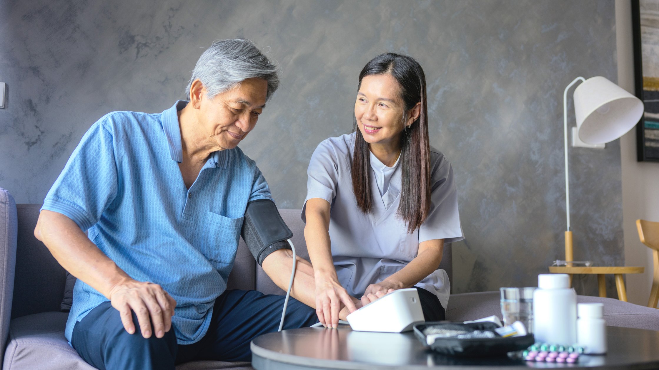 Two people talking sitting on a couch